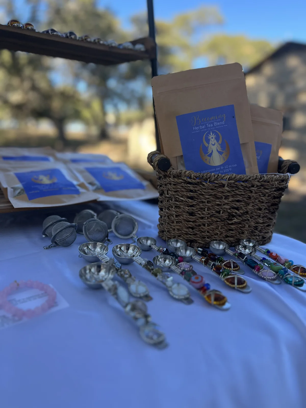 Reading cards and beaded jewelry laid out on a table by candlelight